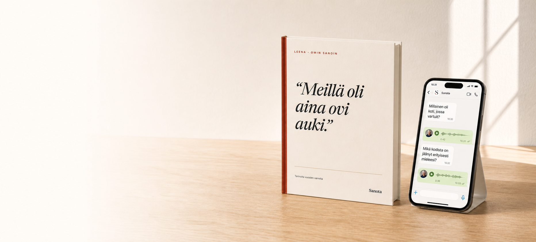 A Sanota hardcover book and an unbroken WhatsApp conversation on a phone, on a pale oak table